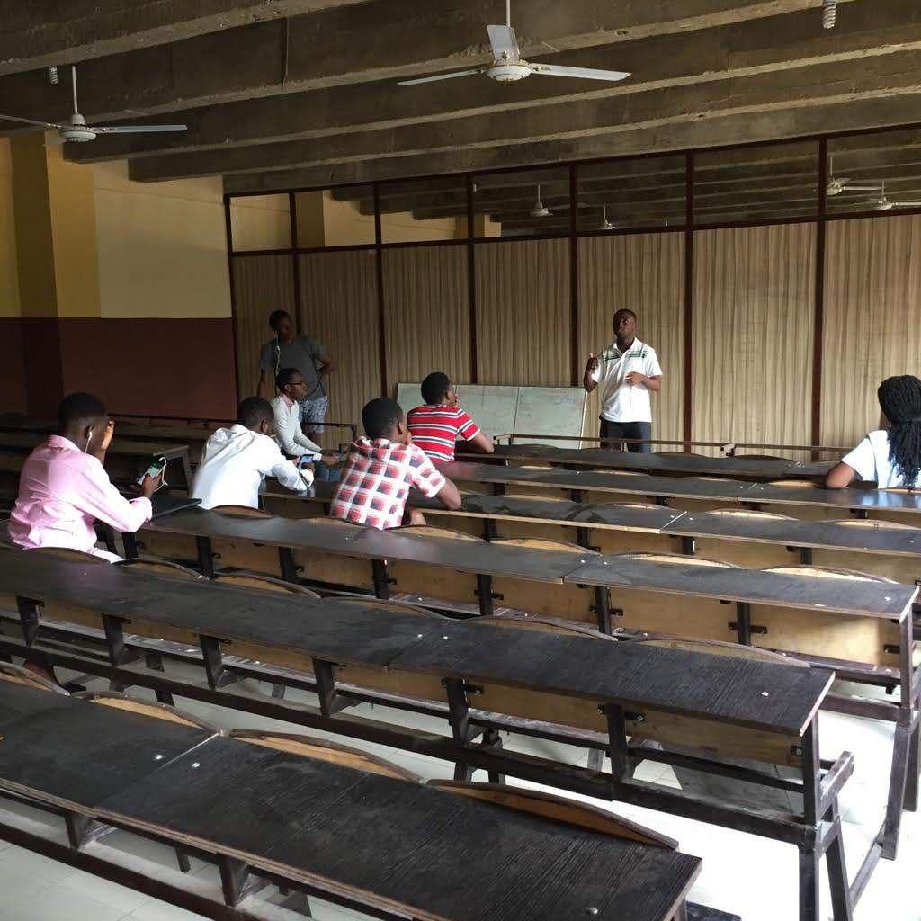 Speaker presenting to audience in lecture hall